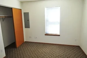 A room with a door and window in it